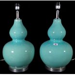 A pair of 20th century Chinese style blue ceramic double gourd shape table lamps, 57cm high.