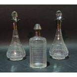 A pair of late Victorian silver mounted faceted glass decanters,