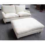 DURESTA; a two seat sofa in cream upholstery, 171cm wide x 77cm high,