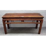 A late 19th century Chinese low altar table, with turned frieze on block supports,
