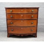 A late Regency inlaid mahogany bowfront chest of four long graduated drawers on splayed bracket