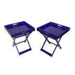 'Shanghai Tang'; a pair of blue acrylic folding occasional tables, with galleried tops,