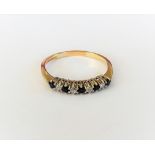 A 9ct gold, sapphire and diamond nine stone half hoop ring,