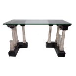 A 20th century glass top console table on two marble column pedestals.