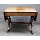 A Regency inlaid rosewood sofa table with a pair of frieze drawers on four downswept supports,