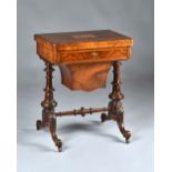 A 19th century figured walnut games/work table, the Tunbridge Ware top depicting a ruined abbey,