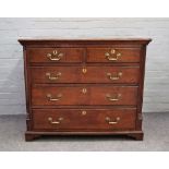 A mid-18th century oak chest of two short and three long drawers flanked by rounded corners,