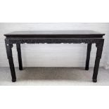 A 19th century Chinese hardwood console table with floral carved frieze on instepped block supports,