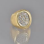 A Kutchinsky 18ct gold and diamond ring, in an oval panel shapped design,