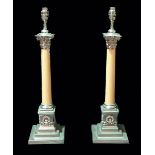 A pair of 20th century Corinthian column table lamps with chrome mounts and pink granite columns,