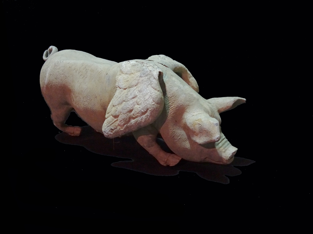 A modern lead model of a winged pig, (a.f.), 65cm wide.