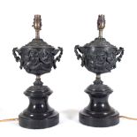 A pair of 19th century bronze twin handled urns,