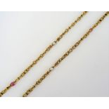 A gold, cultured pearl and ruby bead necklace, in a multiple ropetwist link design,