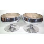 A pair of large silvered metal planters, each of circular waisted form, 64cm diameter.