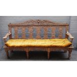 An 18th century style limed oak bench, with silhouette baluster splat back, on turned supports,