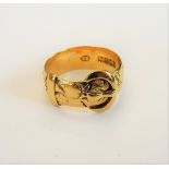 An 18ct gold ring, in a buckle and strap design, London 1919, ring size N and a half, weight 6.