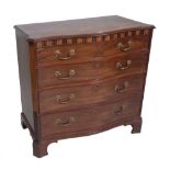 A George III inlaid mahogany serpentine chest, with four long graduated drawers on bracket feet,