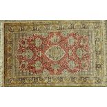 A silk Ghom rug, Persian,