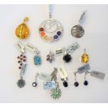 A group of mostly silver jewellery, comprising; fourteen pendants,