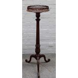 An 18th century style mahogany tourchere stand,