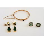 A pair of 9ct gold, emerald and diamond earstuds, each in a cut cornered rectangular design,