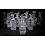 Fourteen Victorian engraved decanters, (lacking stoppers) variously titled; Whisky, Mint, Brandy,