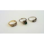 A gold and diamond set five stone ring,