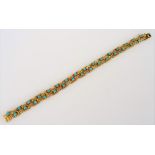 A gold and turquoise bracelet, in a ropetwist bar link design,