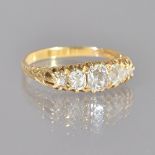 A gold and diamond five stone ring,