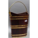 A George III style cooper bound elliptic peat bucket, 42cm wide x 34cm high.