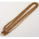 A gold multiple link long guard chain, the front fitted with a swivel, detailed 9 CT, weight 18.