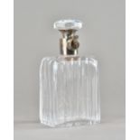 A George V silver mounted cut glass lockable decanter, (lacking key), by Hukin and Heath,