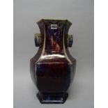 A large Chinese flambé-glazed hexagonal vase, the neck flanked with lug handles,