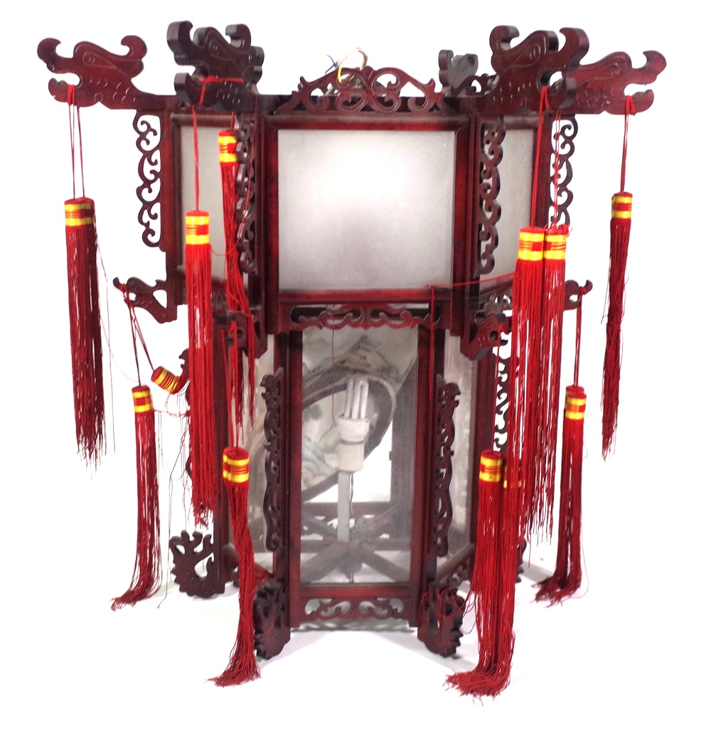 A modern Chinese hanging lantern with carved hardwood octagonal frame,