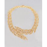 A French gold and diamond set collar necklace, in a graduated overlapping open work foliate design,