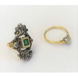 A gold and silver set emerald and diamond set ring in a pierced panel shaped design, ring size J,