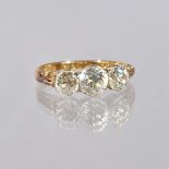 A gold and diamond set three stone ring,