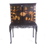 An Edwardian chinoiserie japanned cabinet-on-stand,