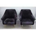 A pair of retro design black upholstered easy armchairs, on turned lacquered brass supports,