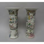 A pair of Chinese famille-rose gu vases, 20th century, each painted with figures in a landcape,