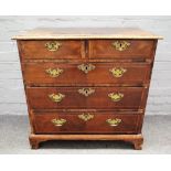A mid-18th century and later inlaid figured walnut chest with two short and three long graduated