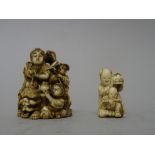 A Japanese ivory netsuke, Meiji period, carved as a woman seated on the back of a recumbent shishi,