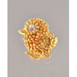 A Kutchinsky 18ct gold, ruby and diamond brooch, designed as a chick,