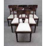 A set of six George III mahogany dining chairs with carved waist rail on lappet supports,