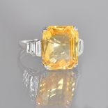 A yellow sapphire and diamond ring,