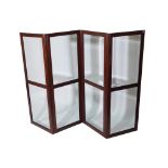 A late 19th century mahogany framed four division screen, with inset bevelled glass panels,
