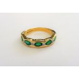 An 18ct gold, diamond and dyed green agate set half hoop ring,