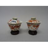 A pair of Chinese famille-rose cups and covers, late 19th/20th century,