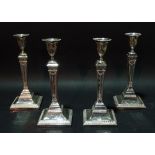 A group of four Victorian silver plate on copper candlesticks,