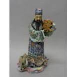 A Chinese porcelain famille-rose figure, 20th century,